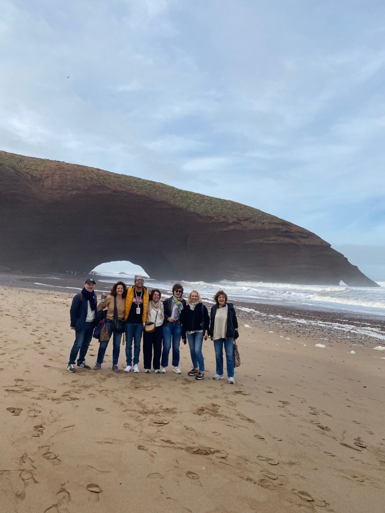 Group photo at the famous Legzira beach stone arches