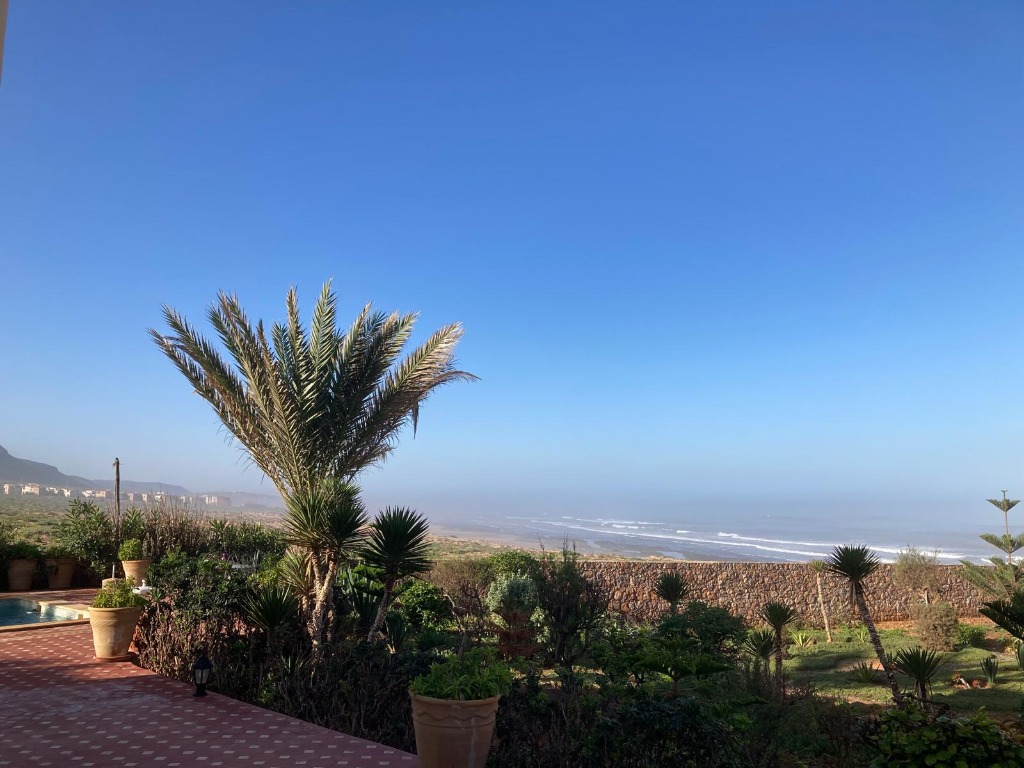 View over the garden to the Atlantic Ocean from Kasbah Ifoulki